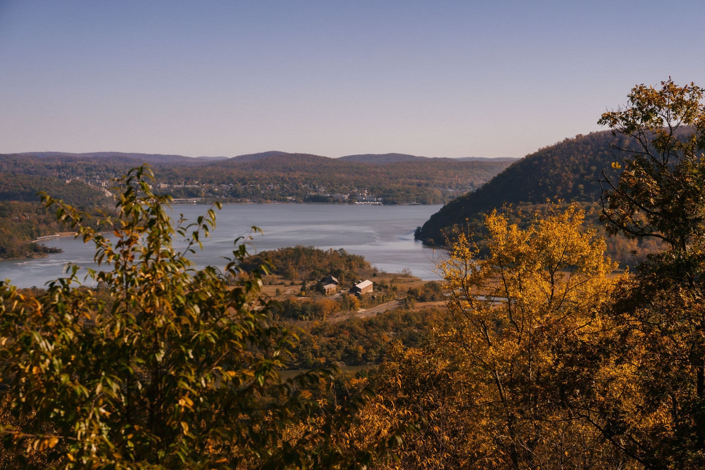 Autumn hills around a valley lake, the kind of country we serve for towing in Qu'Appelle, SK